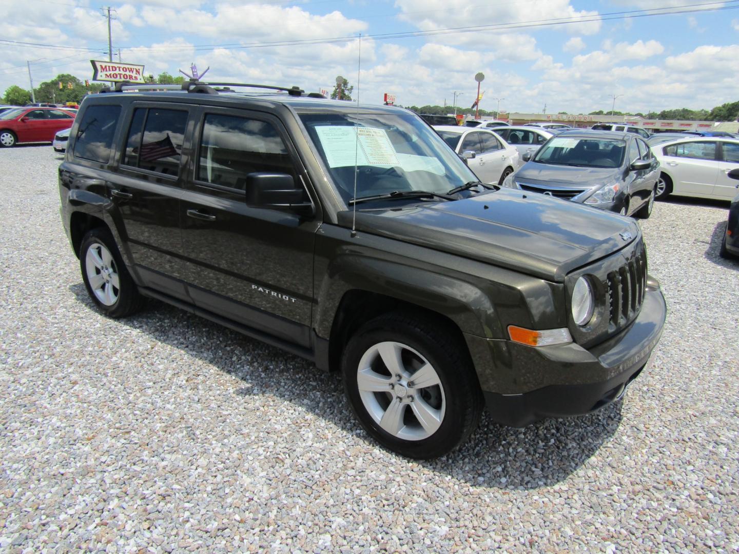 2015 Green /Tan Jeep Patriot (1C4NJPCB2FD) with an 4 CYL engine, Automatic transmission, located at 15016 S Hwy 231, Midland City, AL, 36350, (334) 983-3001, 31.306210, -85.495277 - Photo#0